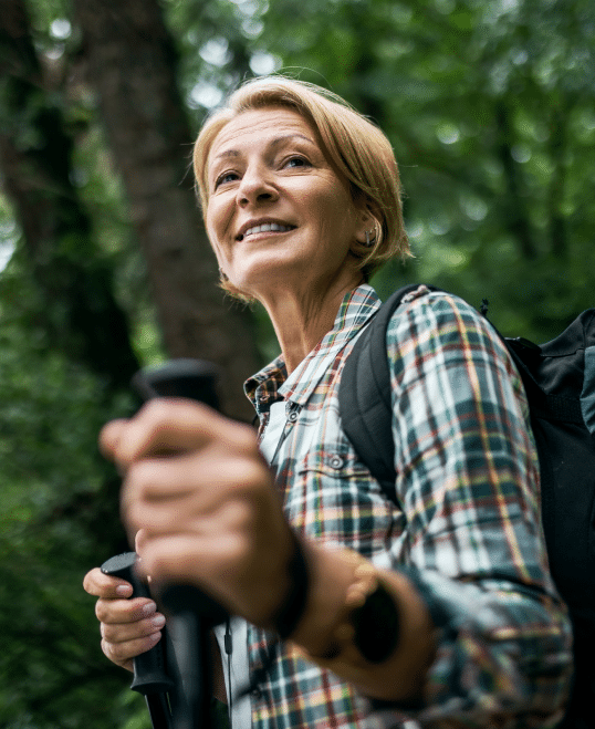 Woman with backpacking and trekking poles